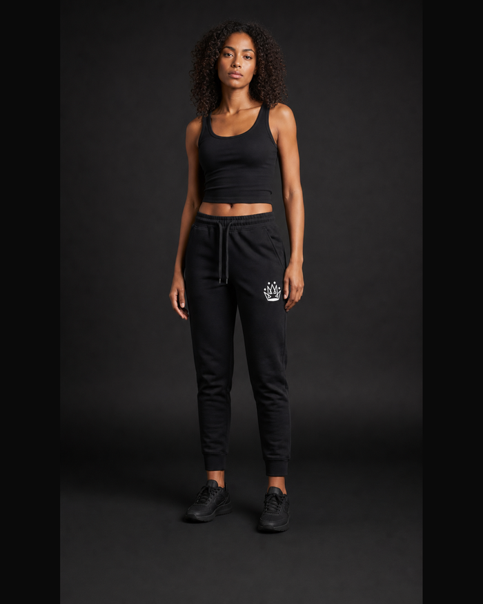 Model wearing Originals CA black jogger with crown, studio portrait