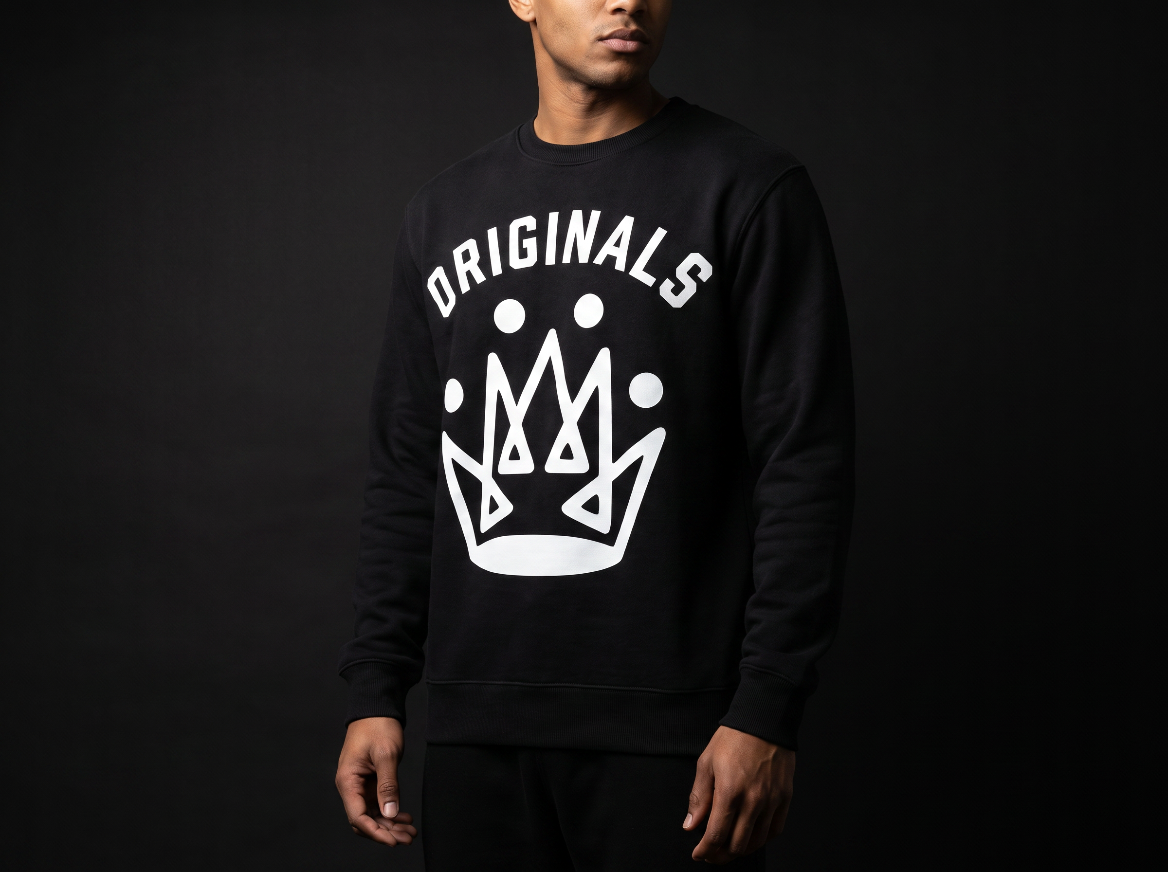 Model wearing Originals matte-black crewneck sweatshirt with white ORIGINALS crown across chest