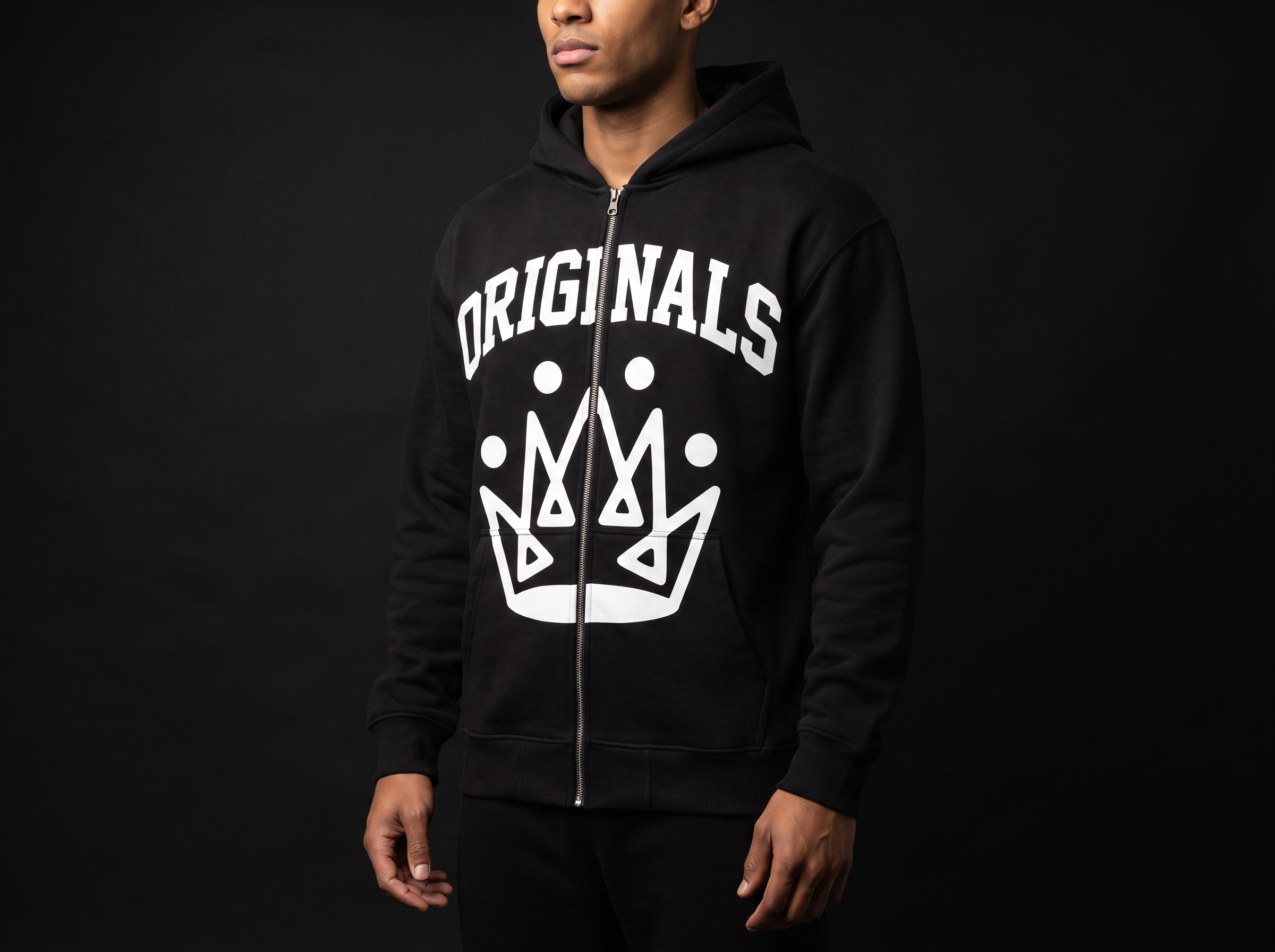 Model wearing Originals matte-black full-zip hoodie with white ORIGINALS crown across chest