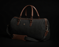 Originals black canvas duffle bag with brown leather trim and crown