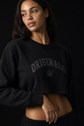 Model wearing Originals cropped black long sleeve with wordmark