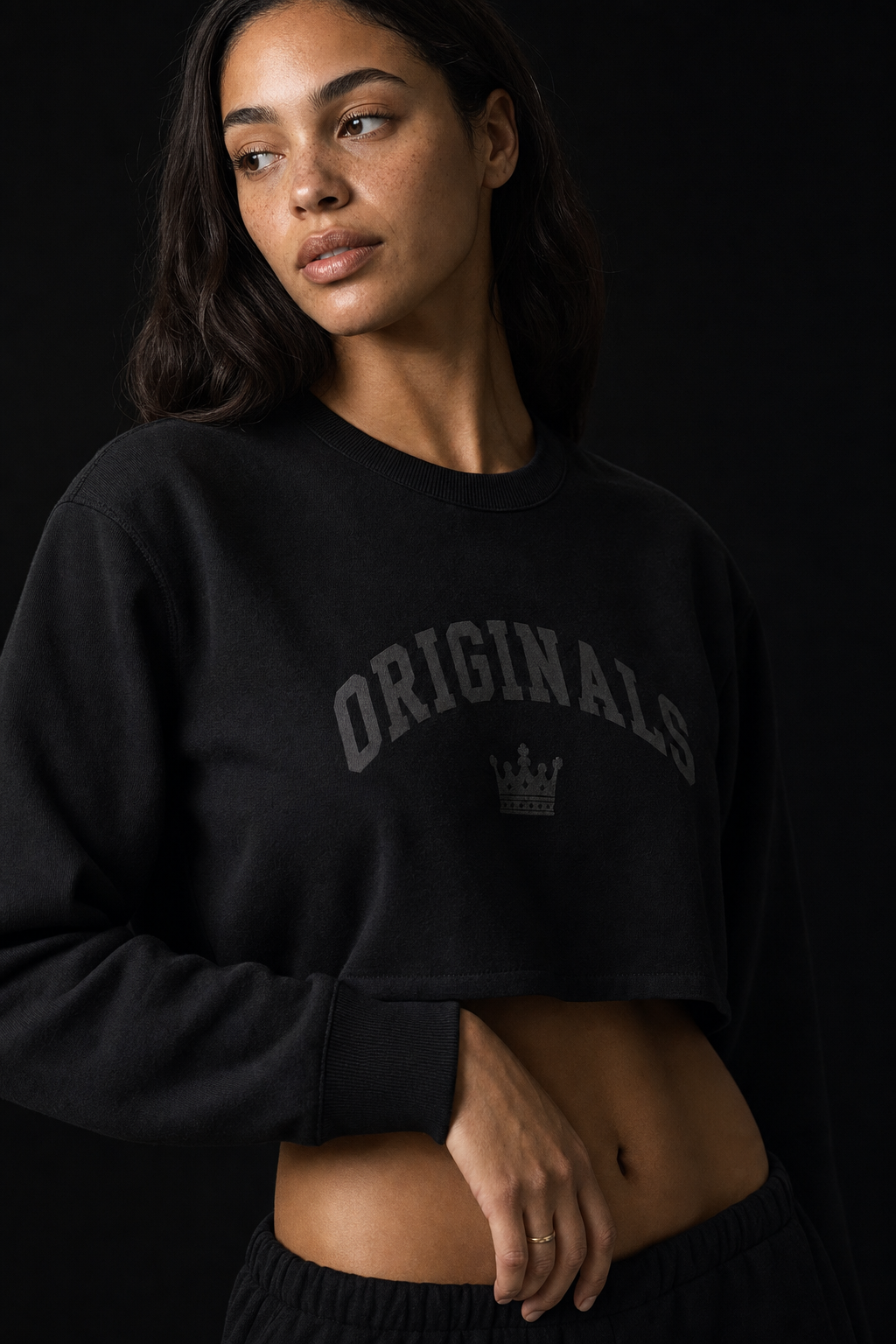 Model wearing Originals cropped black long sleeve with wordmark