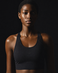 Model wearing Originals black performance sports bra with crown emblem