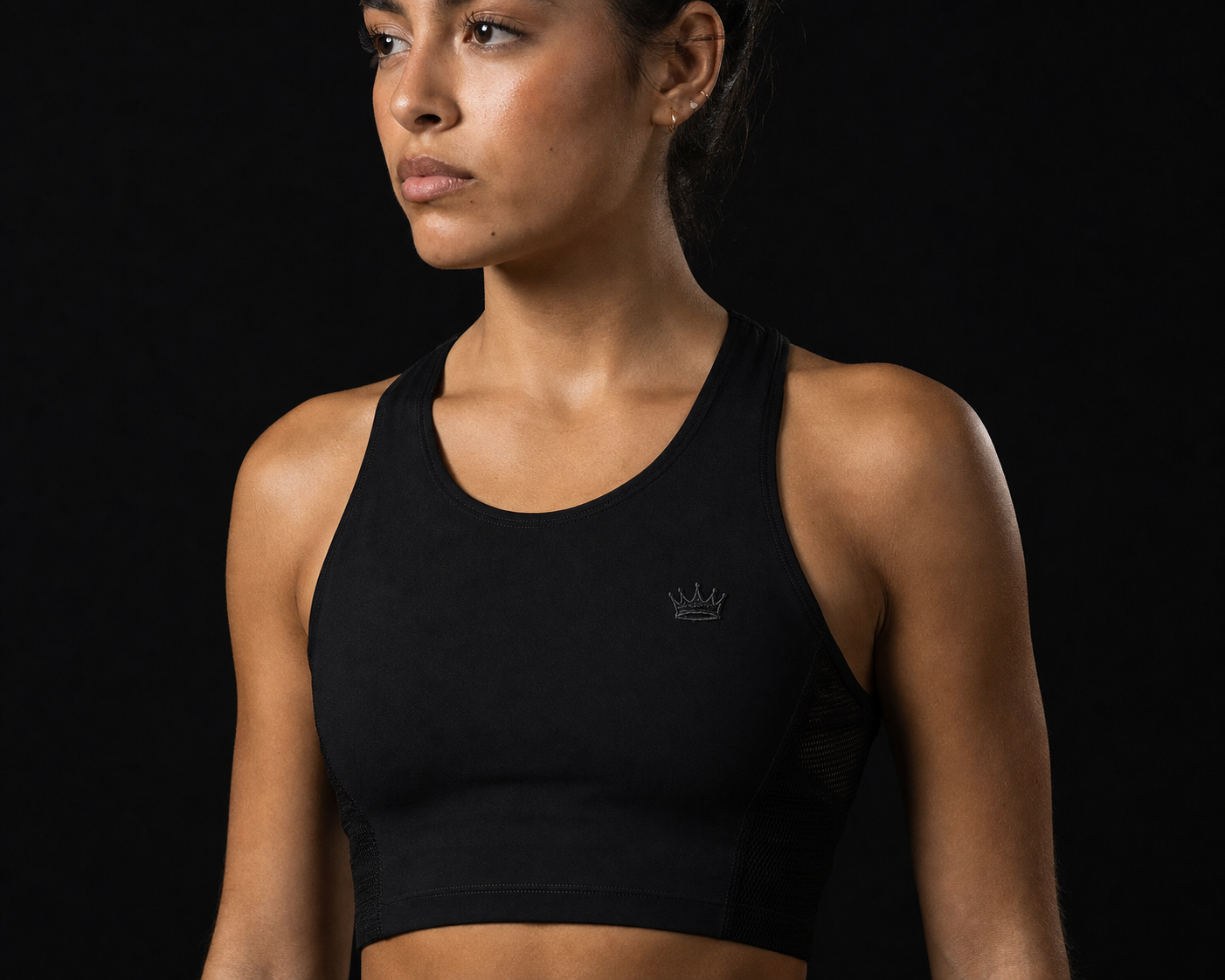 Model wearing Originals cropped performance tank with crown